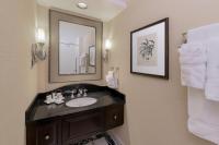 a bathroom with a sink and a mirror at The Raphael Hotel, Autograph Collection in Kansas City