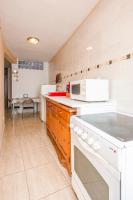 Kuchyň nebo kuchyňský kout v ubytování A Ensuite Apartment con Zona de Patio