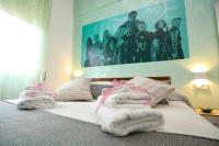 Posteľ alebo postele v izbe v ubytovaní Cineroma Guesthouse