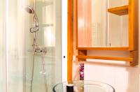 a bathroom with a shower and a glass sink at Sainte Catherine - Duplex 1 chambre in Bordeaux