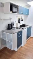 Kuchnia lub aneks kuchenny w obiekcie Studio en rez de jardin avec terrasse privée - Le petit Château Avesnois - TV - WIFI - logement complet
