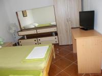 Televízia a/alebo spoločenská miestnosť v ubytovaní Apartments Azoa