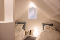 Posteľ alebo postele v izbe v ubytovaní Le Duplex de Maison Passage
