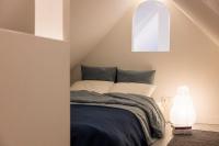 Posteľ alebo postele v izbe v ubytovaní Le Duplex de Maison Passage