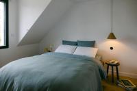 Posteľ alebo postele v izbe v ubytovaní Le Duplex de Maison Passage