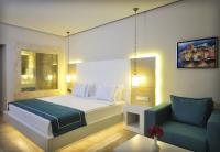 Postel nebo postele na pokoji v ubytování Lugga Boutique Hotel & Beach