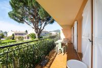 a balcony with a view of a tree at Les Jardins de Provence • Beau Rivage • Proche mer in Carqueiranne