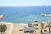a view of a beach with a boat in the water at Les Jardins de Provence • Beau Rivage • Proche mer in Carqueiranne