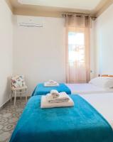 A bed or beds in a room at Odi et Amo - Lido San Giovanni
