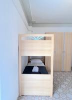 A bed or beds in a room at Odi et Amo - Lido San Giovanni