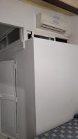 a room with a white wall and a door at Pensión San Benito Abad in Seville