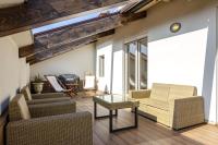 A seating area at Rizzoli Terrace Apartment