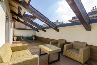 A seating area at Rizzoli Terrace Apartment