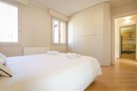 A bed or beds in a room at Rizzoli Terrace Apartment