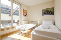 A bed or beds in a room at Rizzoli Terrace Apartment