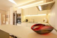 A kitchen or kitchenette at Rizzoli Terrace Apartment