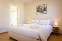 A bed or beds in a room at Rizzoli Terrace Apartment