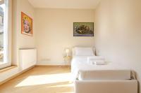 A bed or beds in a room at Rizzoli Terrace Apartment