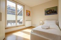 A bed or beds in a room at Rizzoli Terrace Apartment