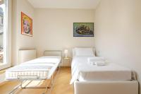 A bed or beds in a room at Rizzoli Terrace Apartment