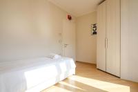 A bed or beds in a room at Rizzoli Terrace Apartment