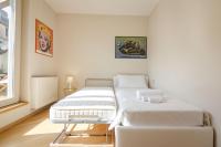 A bed or beds in a room at Rizzoli Terrace Apartment