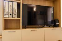 A television and/or entertainment centre at Rizzoli Terrace Apartment