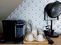 a table with a coffee maker and a blender and a radio at Chambres d&#39;hôtes chez l&#39;habitant - Bed&amp; Breakfast homestay in Huisnes-sur-Mer