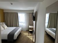 Posteľ alebo postele v izbe v ubytovaní Hôtel Akena Chauray-Niort