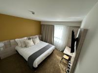 Posteľ alebo postele v izbe v ubytovaní Hôtel Akena Chauray-Niort