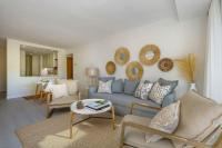 A seating area at New & Beautiful Apt walk to the beach - RDR251