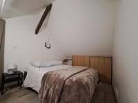 Posteľ alebo postele v izbe v ubytovaní Loft proche des plages et sites du débarquement
