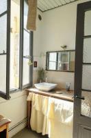 a bathroom with a sink and a mirror at Tout le charme de l&#39;ancien marseillais in Marseille