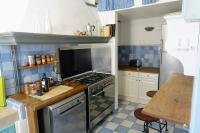 a kitchen with a stove and a counter top at Tout le charme de l&#39;ancien marseillais in Marseille