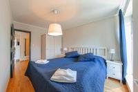 Łóżko lub łóżka w pokoju w obiekcie Apartamenty Sun & Snow Old Town Gdańsk