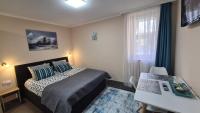 Posteľ alebo postele v izbe v ubytovaní Lucsony Apartman