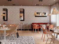 a restaurant with tables and chairs in a room at ibis Styles Porto Vecchio in Porto-Vecchio
