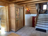 a room with a wooden door and a staircase at Chalet la Grande Motte in Champagny-en-Vanoise