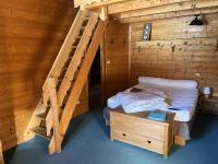 Łóżko lub łóżka w pokoju w obiekcie Chalet le Grand Bec