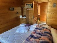 Łóżko lub łóżka w pokoju w obiekcie Chalet le Grand Bec