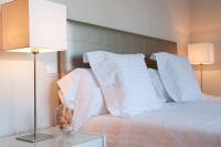 A bed or beds in a room at Par 4 Villa 7