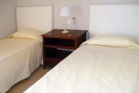 A bed or beds in a room at Par 4 Villa 7