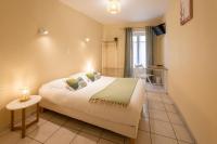 L'Aptois Hôtelにあるベッド