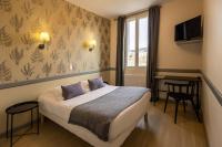 L'Aptois Hôtelにあるベッド