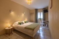 L'Aptois Hôtelにあるベッド