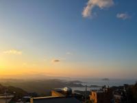 a view of the sunset from a city at Cen Pin B&amp;B in Jiufen