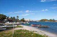 a group of boats are docked on a beach at Pousada Boulevard in Cabo Frio