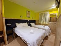 A bed or beds in a room at Pension Izar Bat Guesthouse