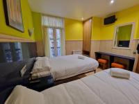 A bed or beds in a room at Pension Izar Bat Guesthouse