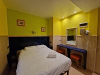 A bed or beds in a room at Pension Izar Bat Guesthouse